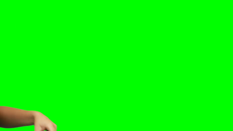 person making hand gesture against green screen background