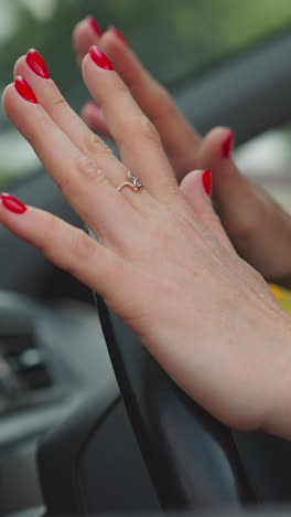 irritated woman hits steering wheel getting stuck in heavy traffic jam in city center. impatient female driver hurries up home closeup slow motion