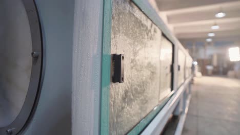 close-up of a wet conveyor belt in a factory