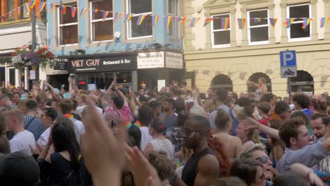 leeds pride lgbtq festival 2019 panning shot of the crowd as they dance and wave their flags short alternative version 4k 25p