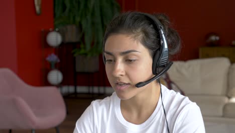 close-up of happy indian woman with laptop having video conference