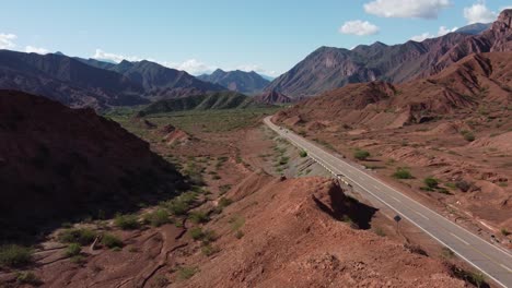 Mountain-landscape-aerial:-cars-drive-on-Tres-Cruces-highway-Argentina