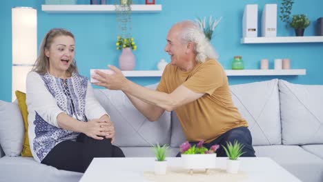 man giving gift to woman.