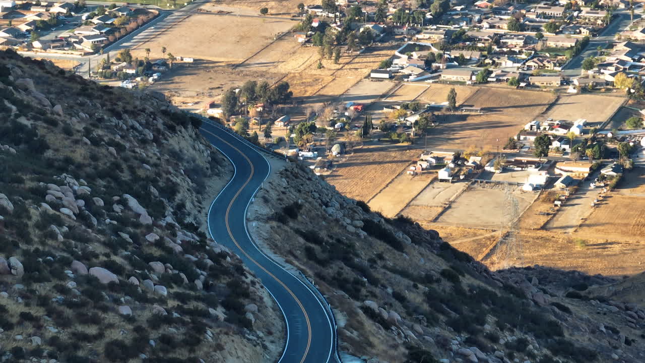 Aerial view of a empty road in the San Bernardino mountains of California, sunset