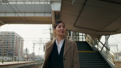 business woman at train station