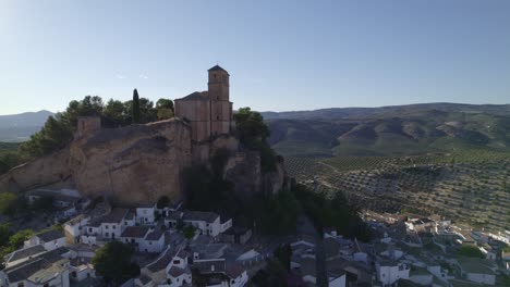 montefrio. village church. iglesia de la villa. church next to cliff. aerial view of andalusian town and church on cliff. montefrio. andalusia. spain.