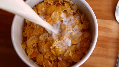 milk being poured in cornflakes