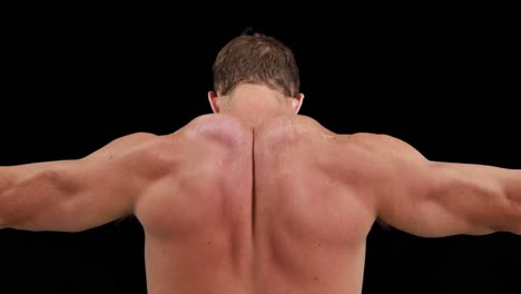 Muscular-man-flexing-his-back-muscles