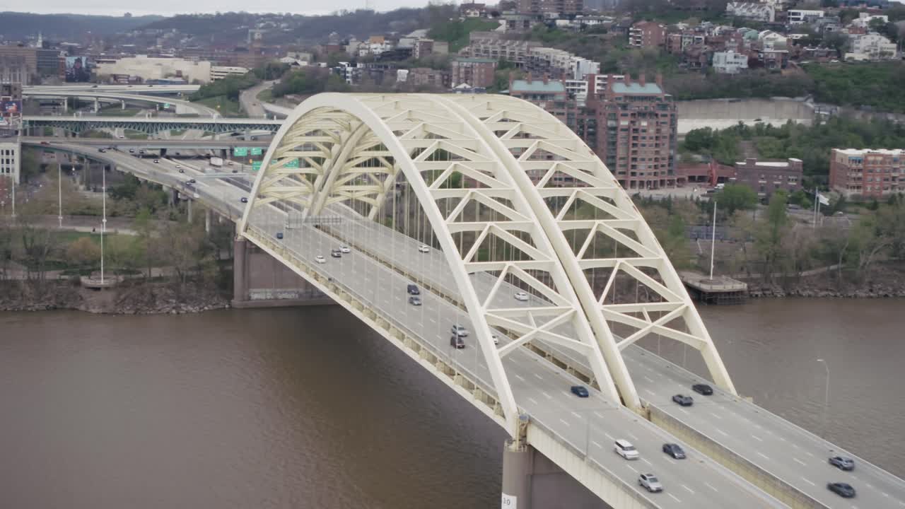 Bridge over the Ohio River in Cincinnati, Ohio with drone video moving in a circle.