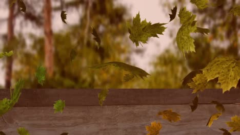 digital animation of multiple autumn leaves floating over wooden surface against forest