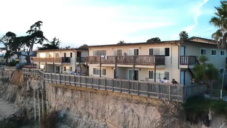 rising aerial view of the cliff town with house