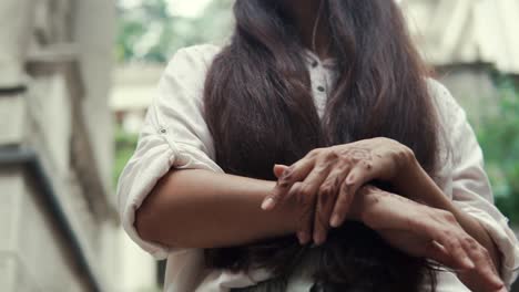 woman with henna tattoo on hands