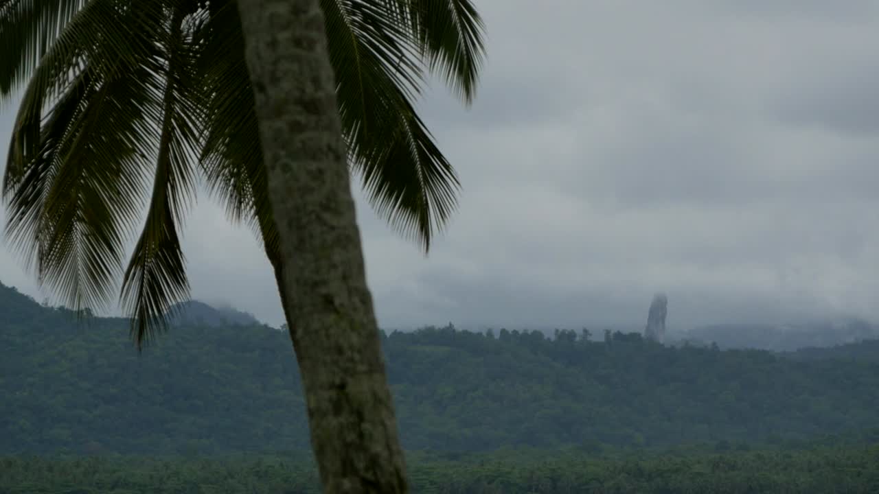A Huge Rock Formation In The Distance Behind The Beautiful Landscape In São Tomé Island - Time Lapse