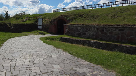 a beautiful path made of tiles towards the entrance of museum fortress korela, russia