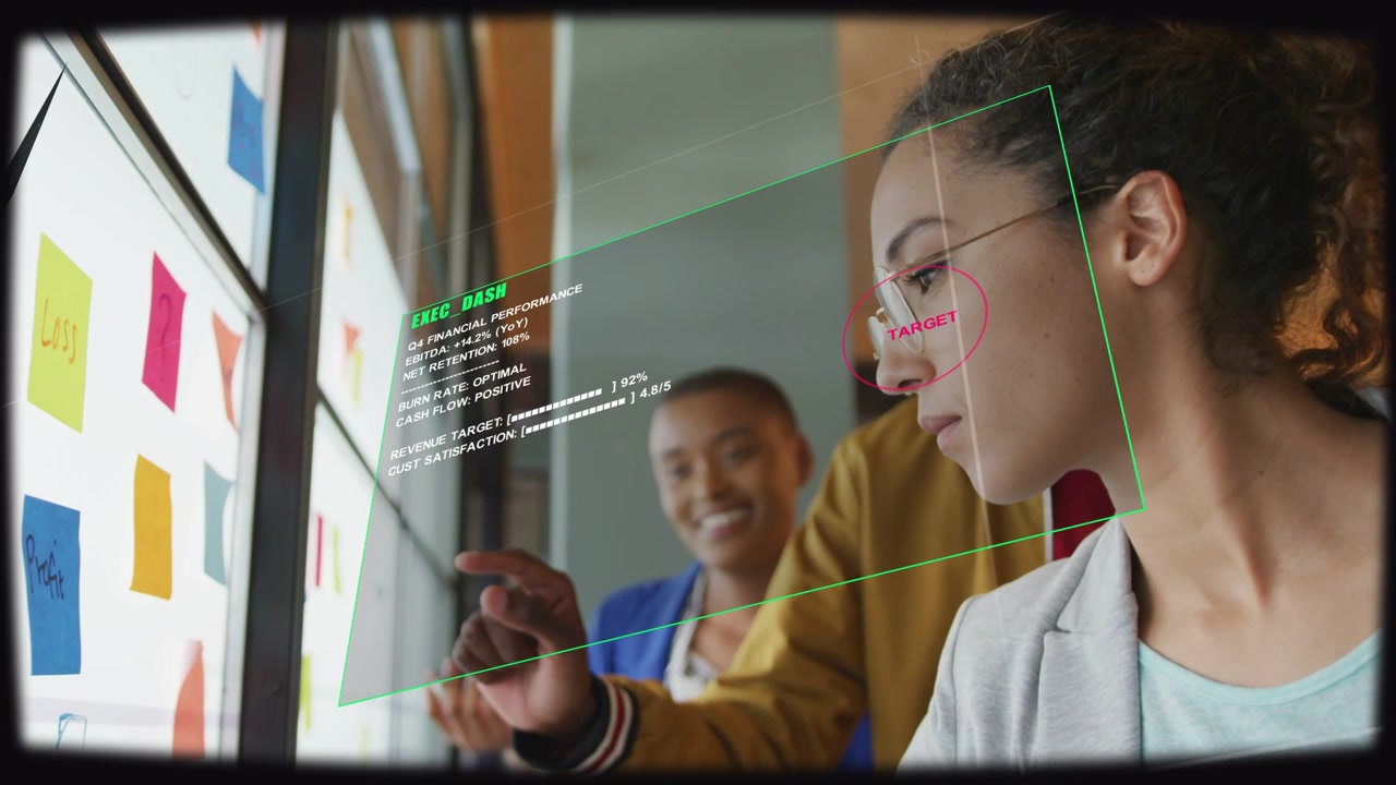 Right woman leaning, colleague pointing and AR overlay appearing, editing sticky notes for business