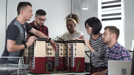 team discussing building model