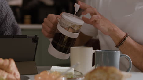 Couple enjoying coffee and breakfast