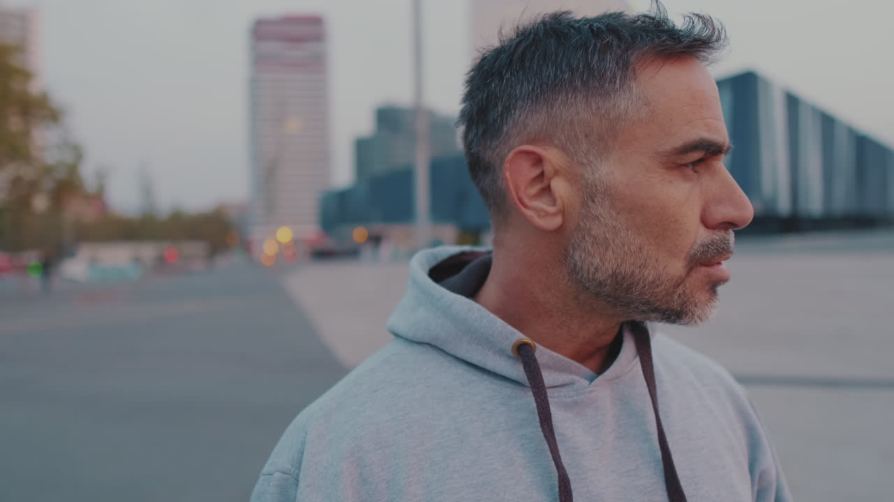 Portrait of a Man in a Hoodie in the City