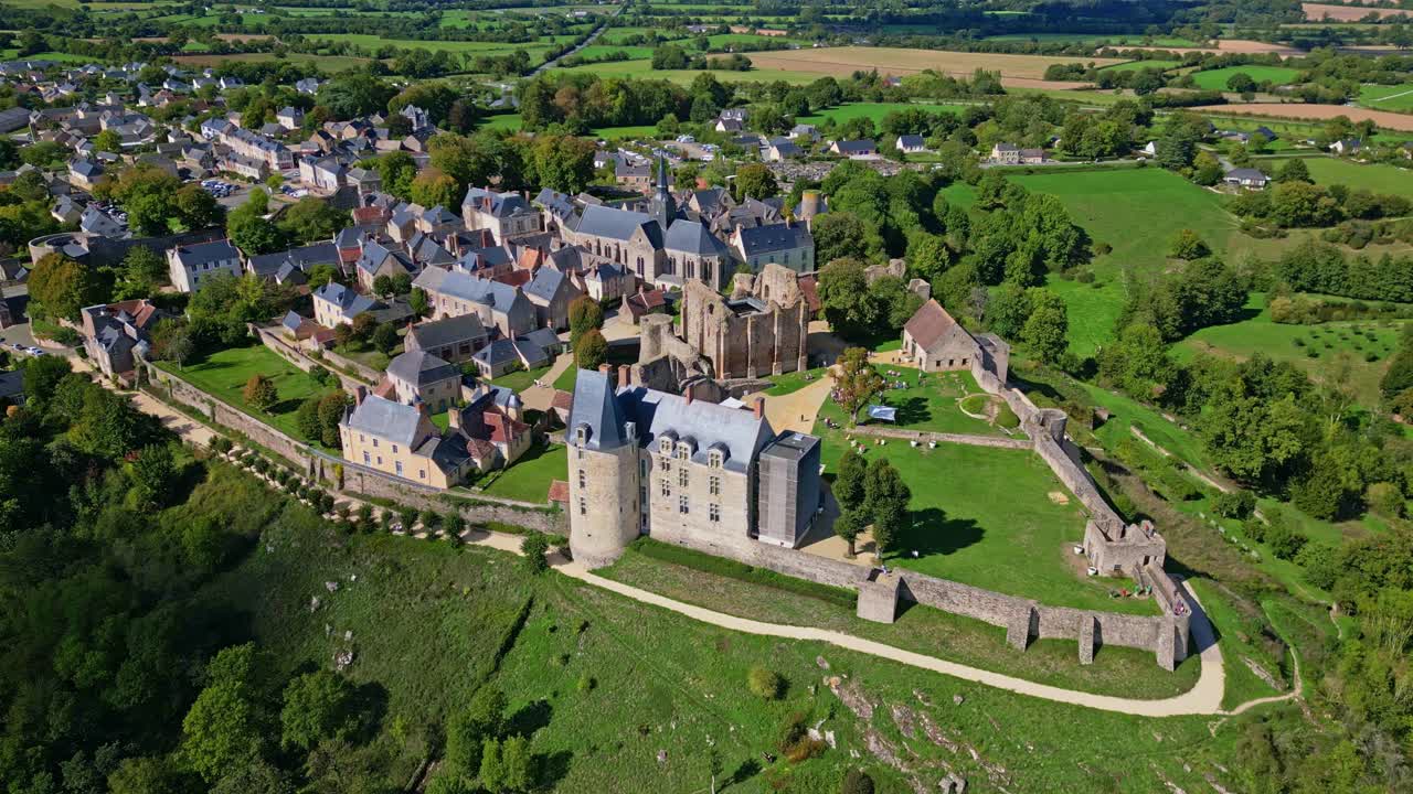 Drone approach to medieval fortress and stone structures of Sainte Suzanne village