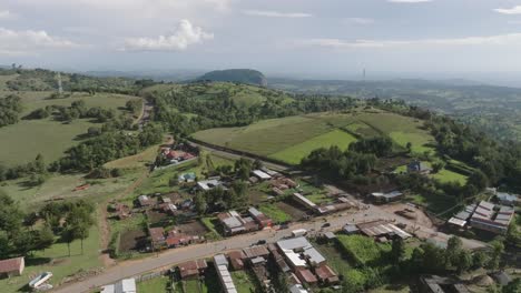 Drone-shot-of-green-farms-and-landscape-showing-the-Rift-Valley-in-West-Pokot-County,-Kenya