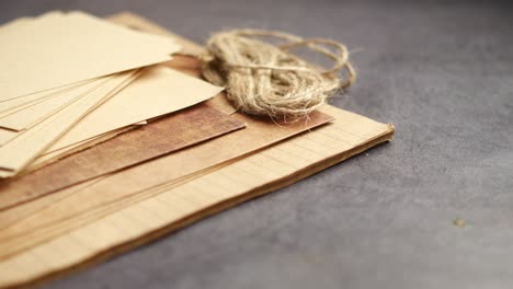 vintage paper, twine and brown paper on a desk