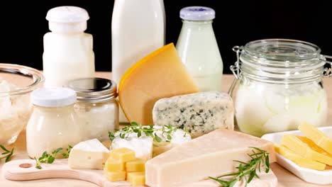 various dairy items arranged on a black background