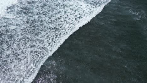 rolling waves in nusa dua off the coast of bali, aerial