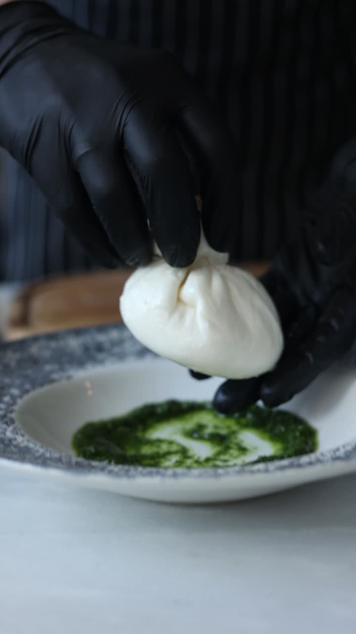 Preparing Burrata with Pesto Sauce