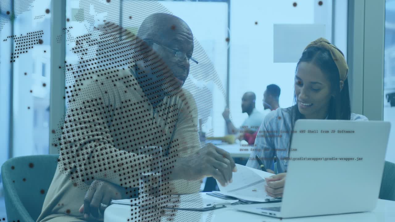 Woman presenting paper, mentor pointing, reviewing for feedback, noting on laptop under tech map