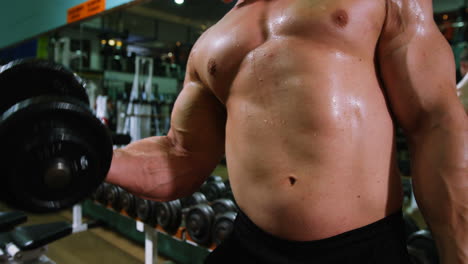 man lifting heavy dumbbells