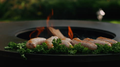 Food-preparing-for-bbq-party.-Juicy-sausages-cooking-with-herbs-outdoors