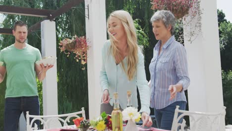 happy family eating together at table