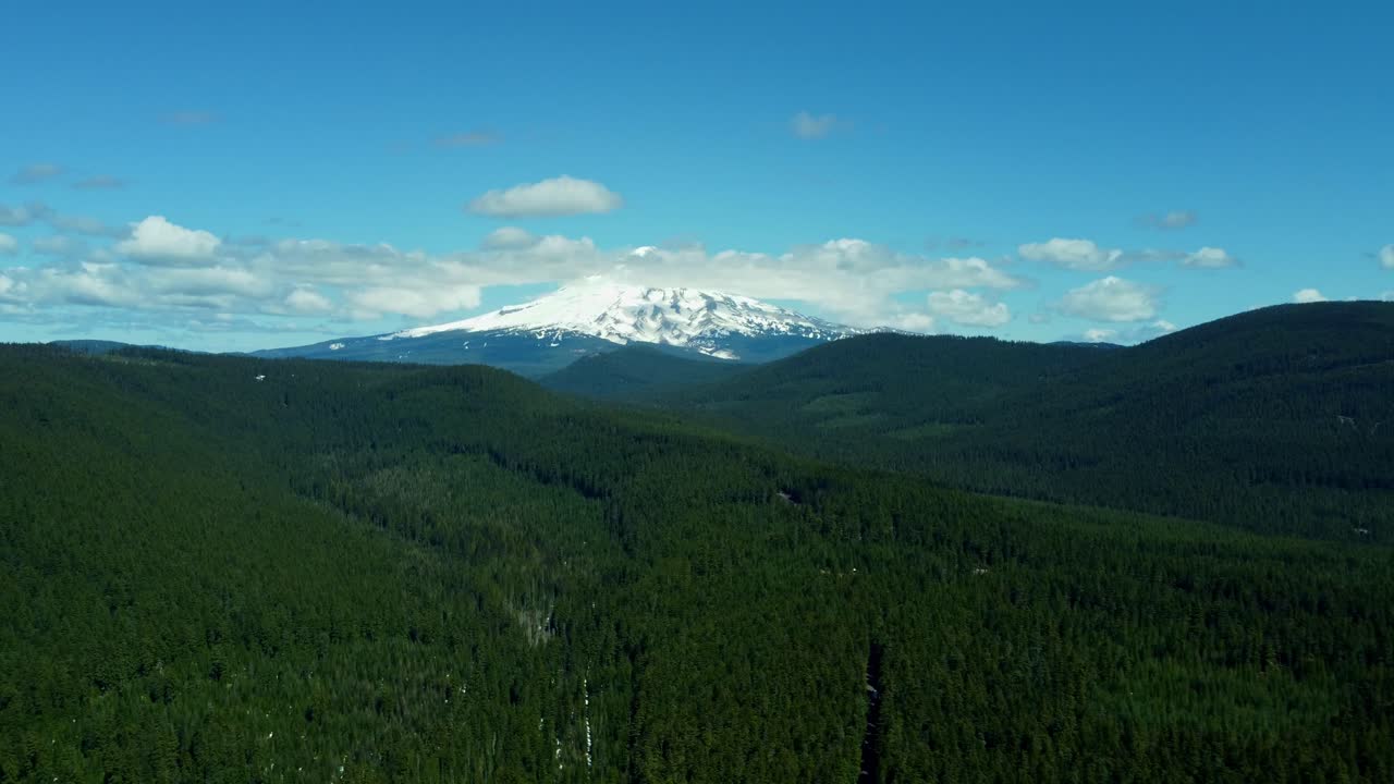 US, Oregon, Mt Hood, Clear Lake, 2025-04-22 - Drone view of Mt Hood at Clear Lake. On a spring day, with some clouds, viewed from the Southeast.