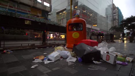 overflowing rubbish bin in downtown hong kong