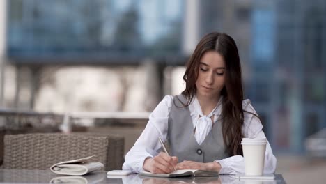 Cute-Stylish-Woman-Sitting-On-Summer-Terrace-Receives-Joyful-Message-On-Phone