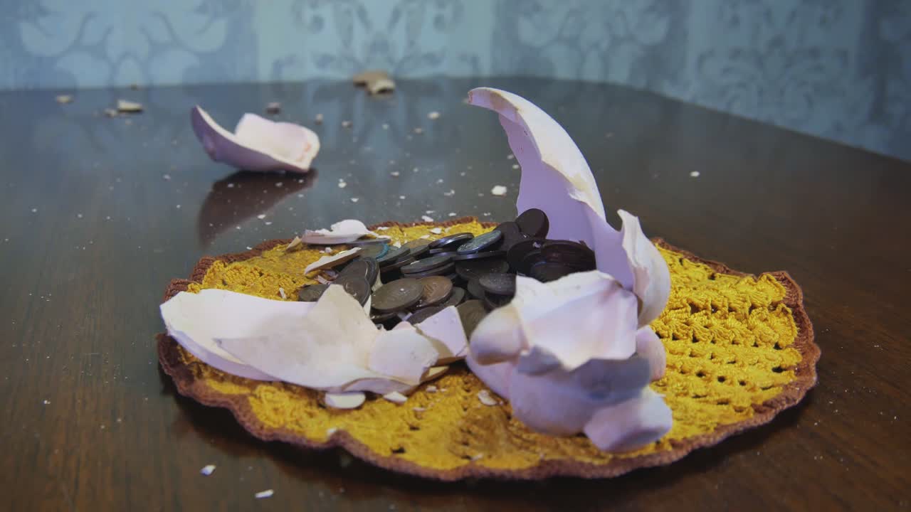 Little Hammer Smash Piggy Bank With Coins. Video Dolly Arc Left