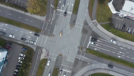 light traffic road junction in suburban reykjavik, top down aerial