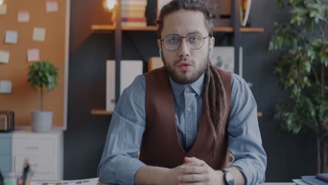 man on a video call in office