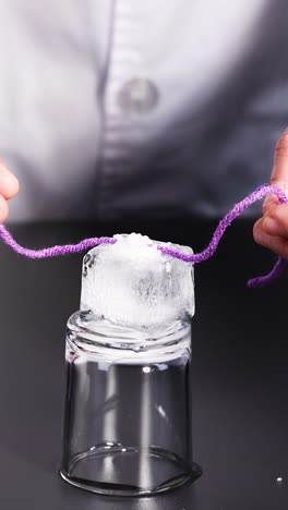 science experiment with ice and string