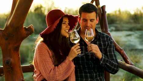 couple having a romantic moment, tasting some wine