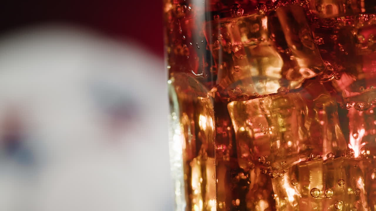 Close-up of a glass of ice-cold soda