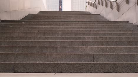 modern grey stone staircase in the city with nobody. the camera moves up