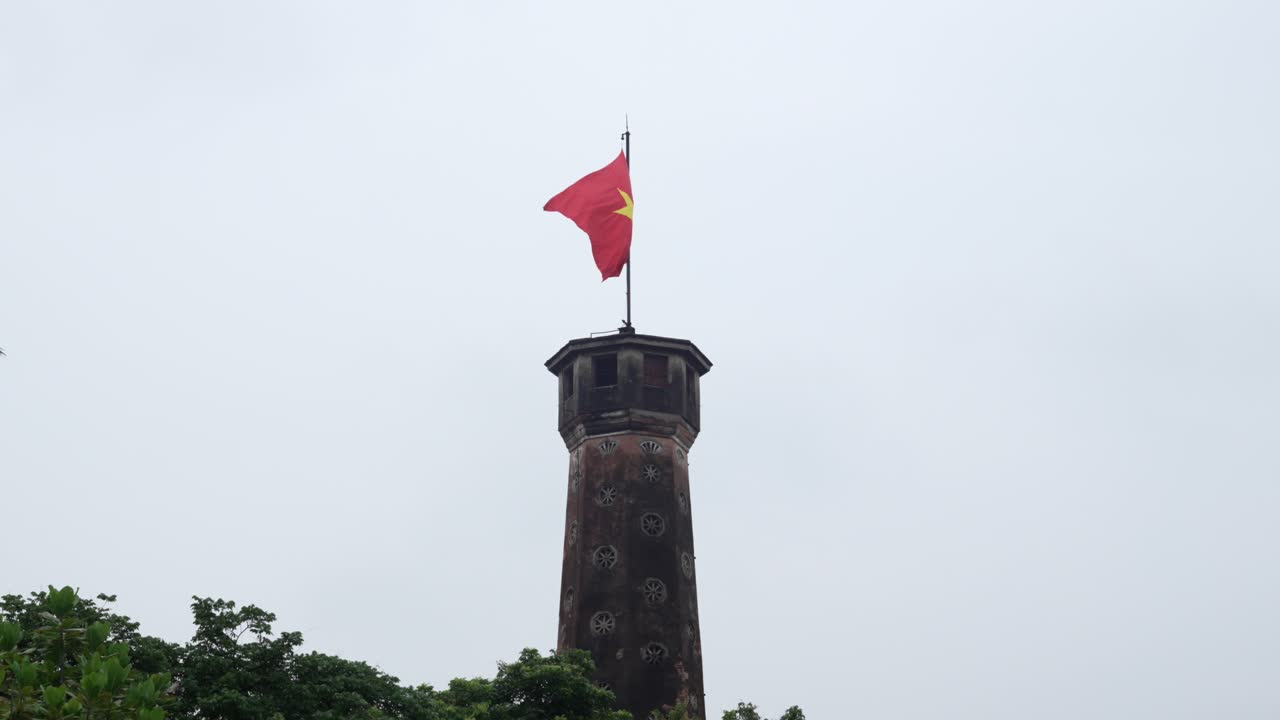 Vietnam Socialist Republic communist country flag yellow star red background tower top Hanoi