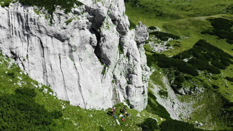 group of friends rock climbing in kamnik-savinja alps, korosica, slovenia