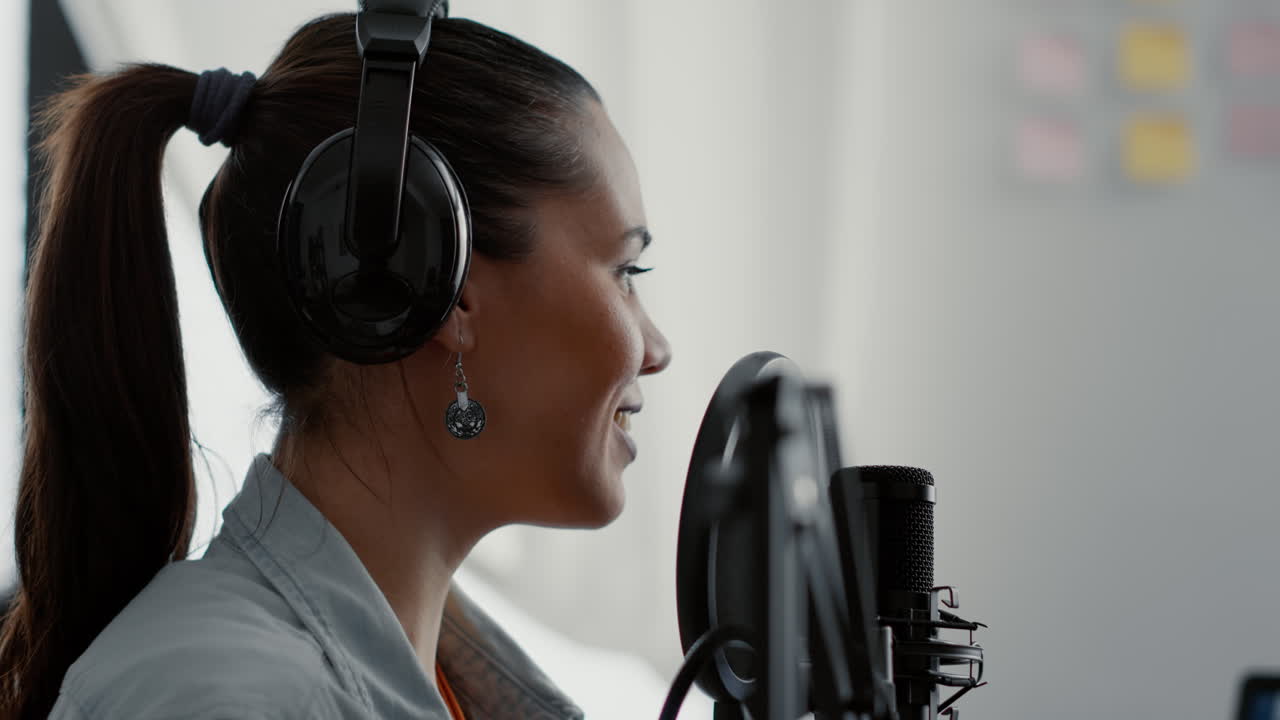 Smiling influencer broadcasting internet talk show while speaking to public