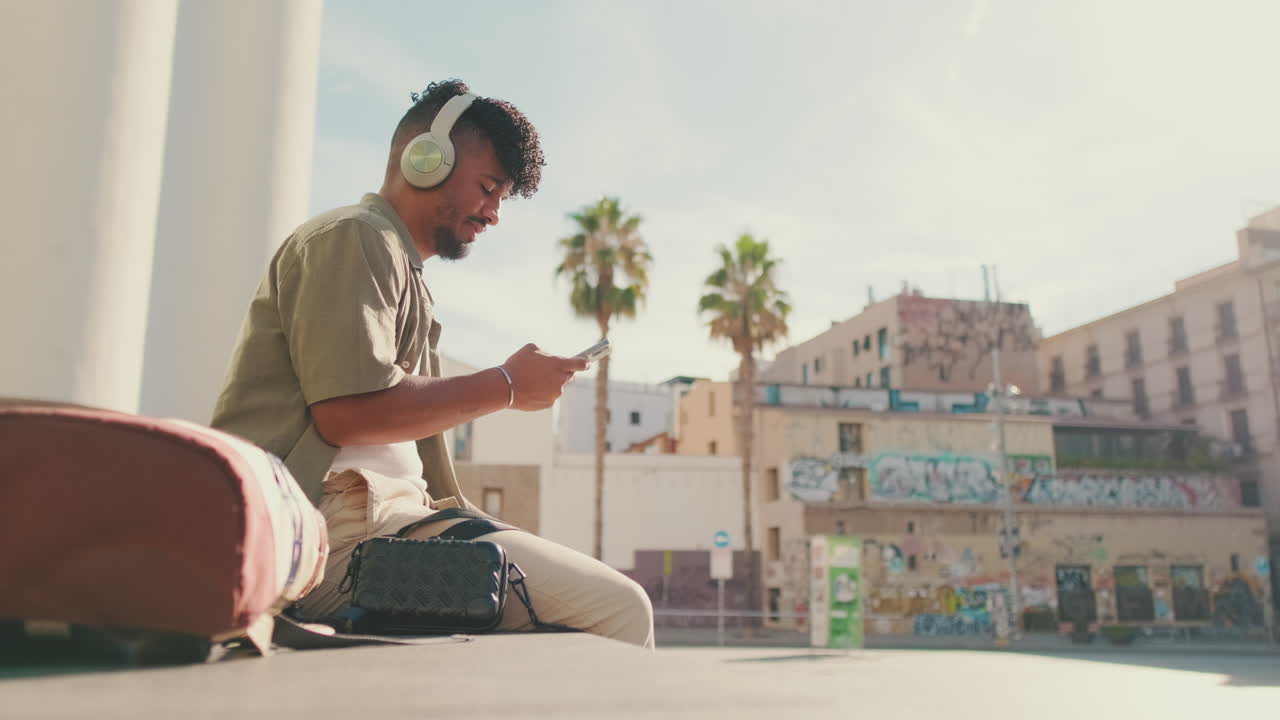 Man Listening to Music in the City