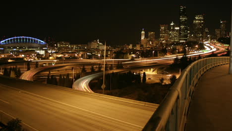 traffic drives along a seattle freeway at night 1