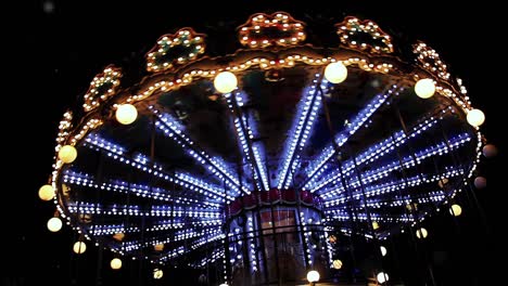 carousel old-fashioned style carousel, carrousel, merry-go-round, at night in paris, france. slow motion. 4k resolution.