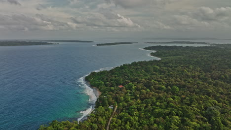 bocas del toro panama aerial v3 flyover paunch capturing pristine and serene seascape of tropical coastal island with dense lush green forest natural reserve - shot with mavic 3 cine - april 2022