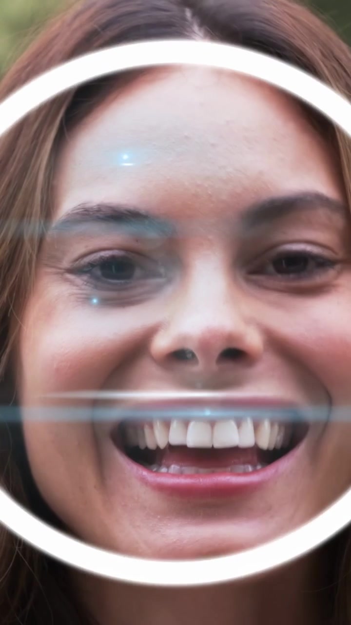 Vertical video: Woman smiling, HUD appearing and expanding with blue scans sweeping, demoing AR